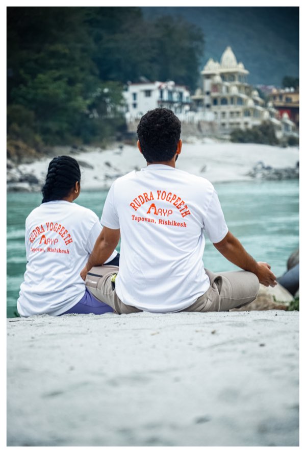 Group photo of yoga teacher training graduates in Rishikesh